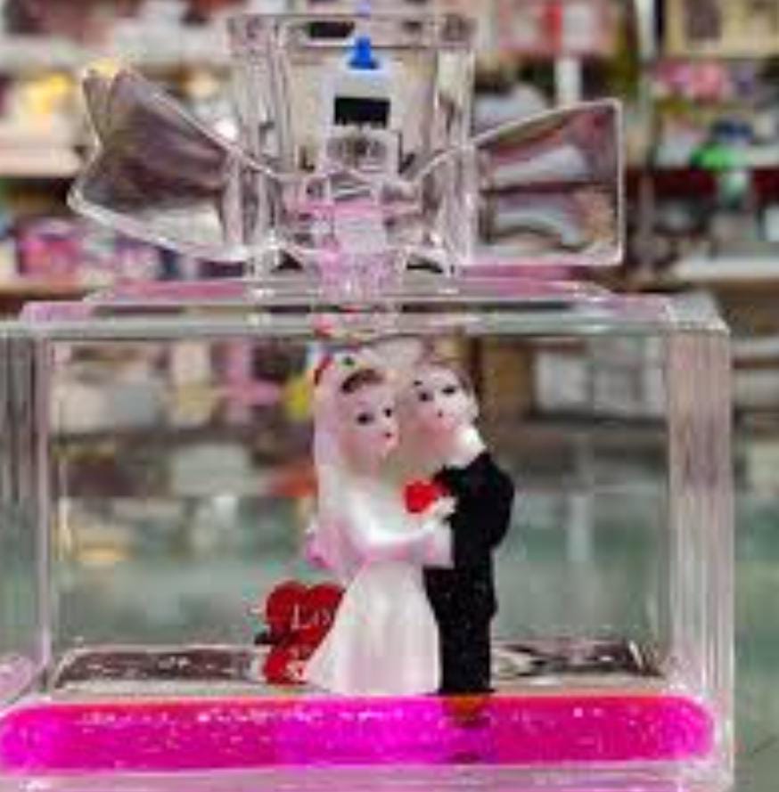 Wedding Couple Showpiece with Perfume Bottle Design – Pen Stand & Paper Holder